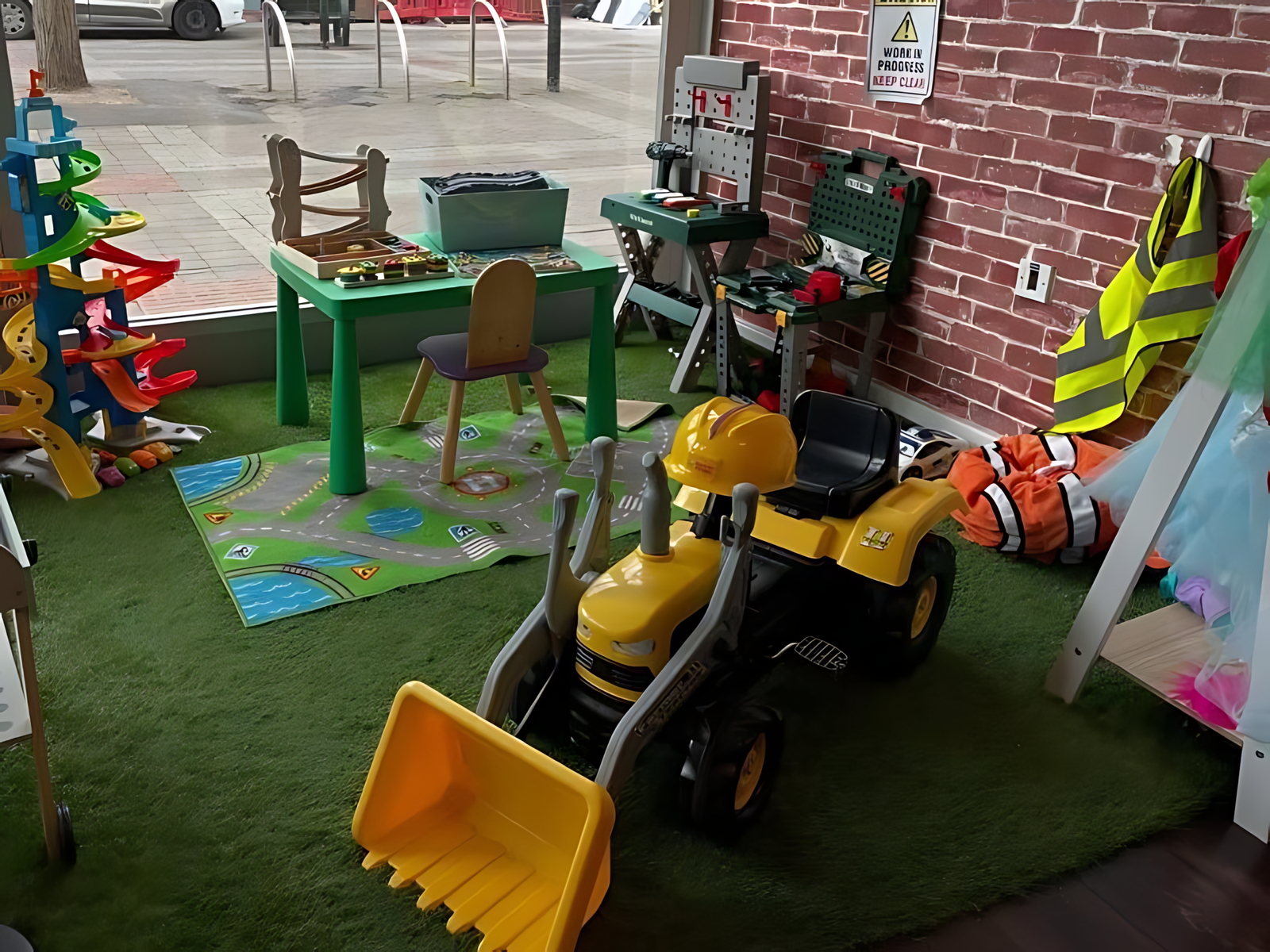 Children playing in the role-play village during an open play session.