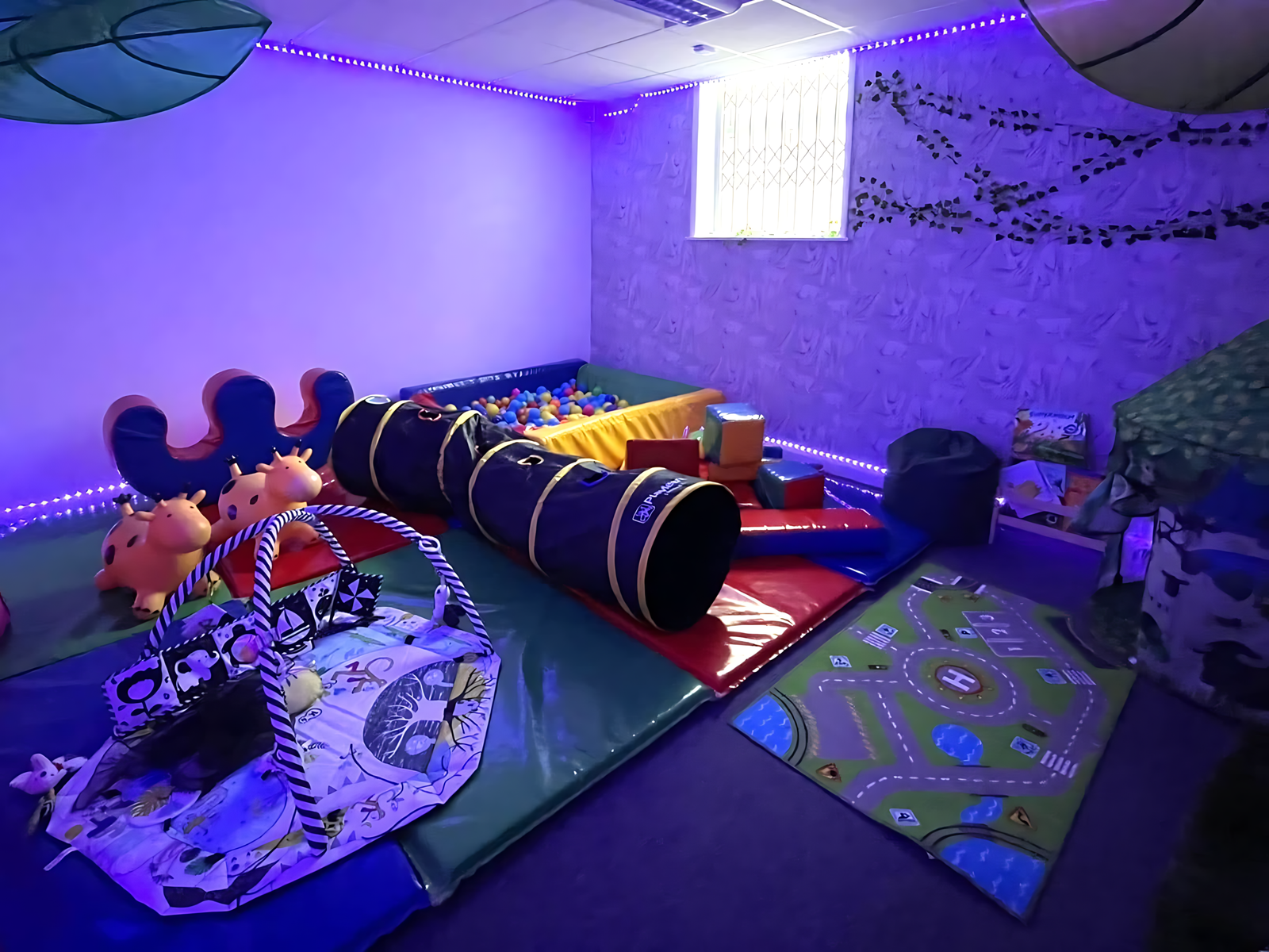The sensory room at Mollie's Party Paradise, with soft lighting and calming textures.